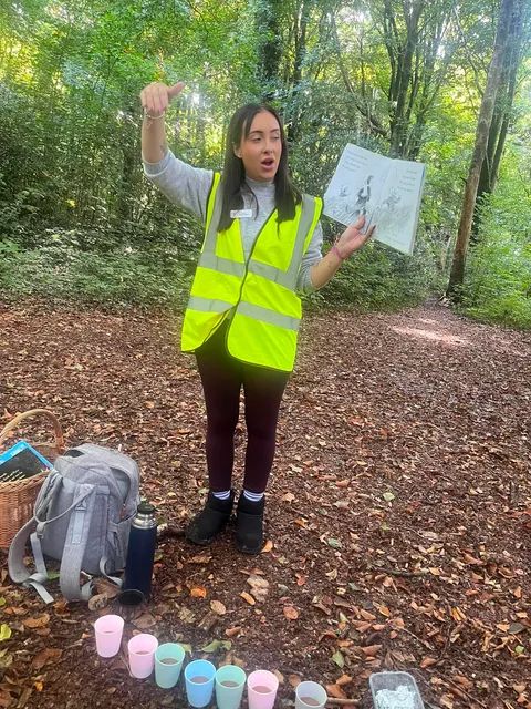 Forest School instructor leading an outdoor education activity