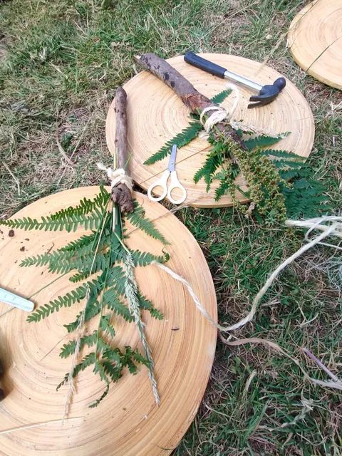 Children taking part in a forest school craft activity with natural materials